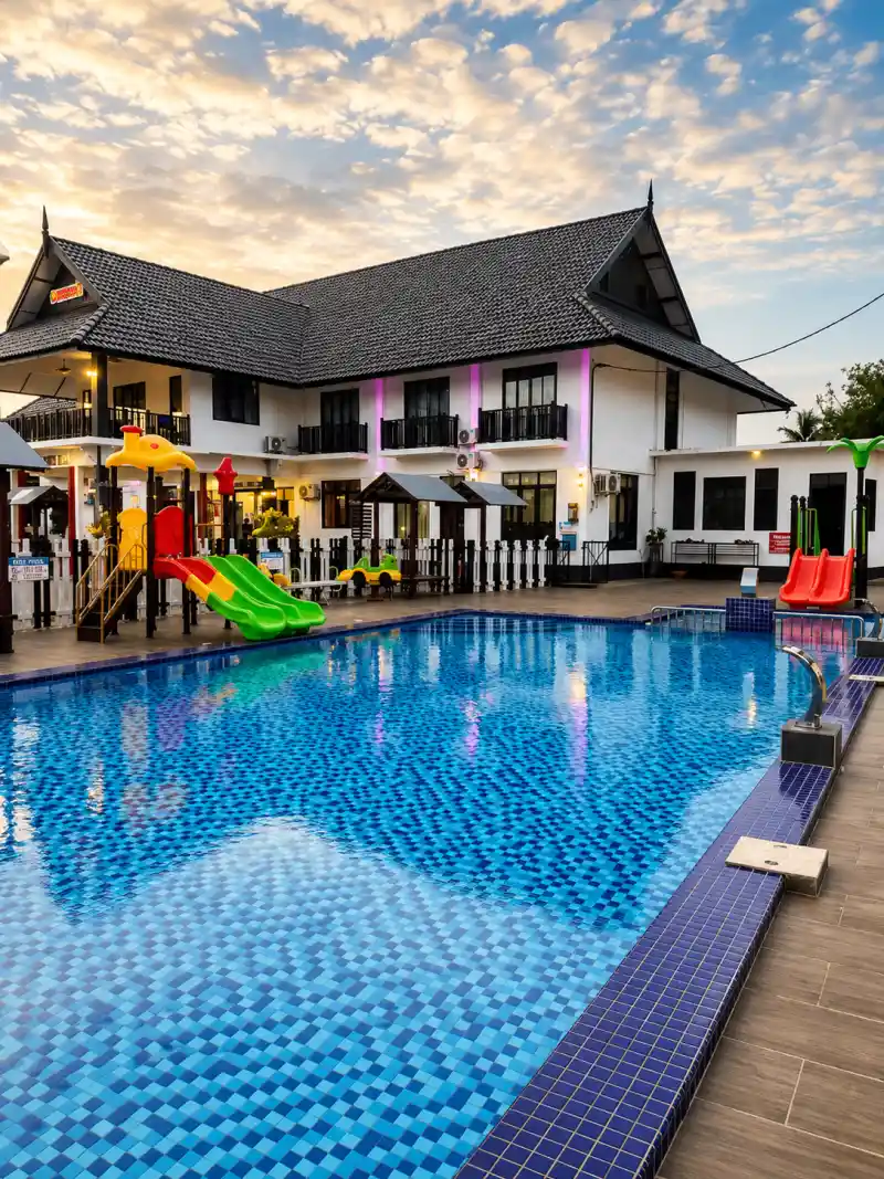 Fenced outdoor pool with shallow kids' pool at Villa Wanie Inn